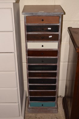 Lot 297 - A tall narrow chest of drawers