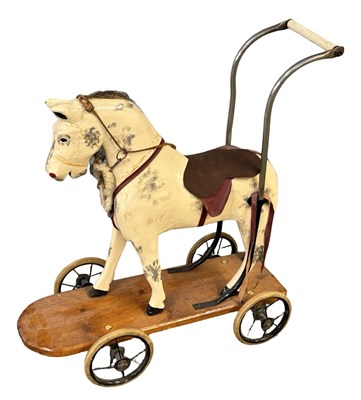 Lot 423 - An unmarked vintage push-along toy horse