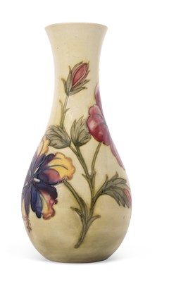 Lot 51 - A Moorcroft vase with tubelined floral pattern...