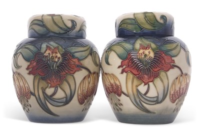 Lot 54 - A pair of Moorcroft jars and covers both with...