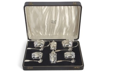 Lot 232 - A cased George V silver condiment set...