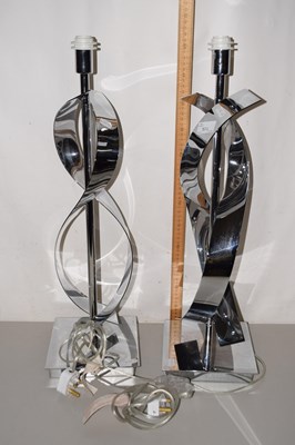Lot 174 - A pair of modern stainless steel table lamps