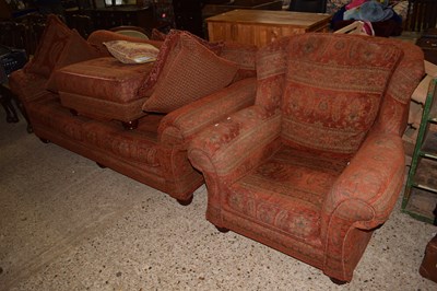 Lot 275 - A large red sofa with floral fabric covering...