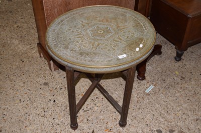 Lot 310 - A vintage brass topped folding table