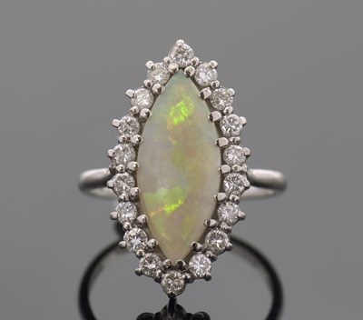 Lot 291 - An 18ct opal and diamond ring, the marquise...