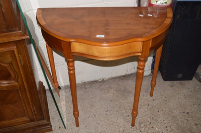 Lot 389 - A reproduction yew wood veneered hall table