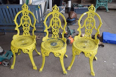 Lot 403 - A set of three cast aluminium garden chairs