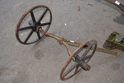 Lot 409 - A single iron axle with two five spoke wheels
