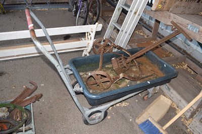 Lot 414 - A pull along garden barrow and various implements