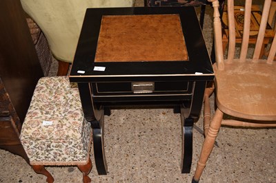 Lot 316 - A modern ebonised finish side table with X...
