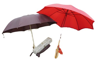 Lot 111 - A red cane handled parasol, Paragon by S.Fox &...