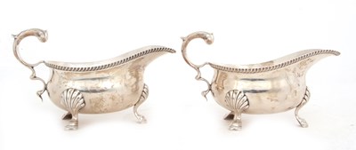 Lot 200 - A pair of George V silver sauce boats of...