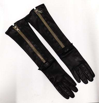 Lot 130 - Prada: a pair of black leather gloves with two...