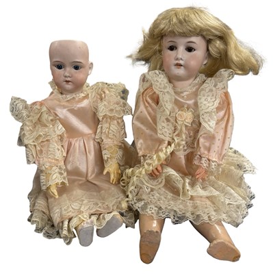 Lot 326 - A pair of German bisque headed dolls in pink...