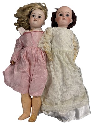 Lot 323 - A Pair of large continental bisque headed...