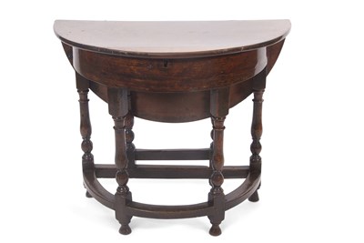 Lot 344 - A late 17th Century oak demi-lune side table...