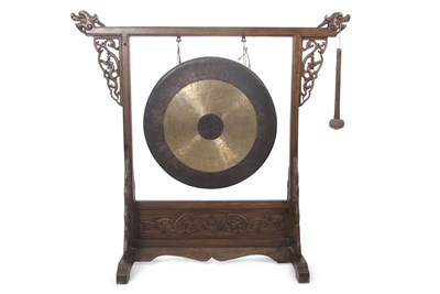 Lot 373 - A large Chinese elm framed dinner gong, the...