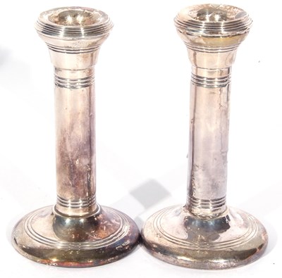 Lot 65 - Pair of George V silver candlesticks of plain...