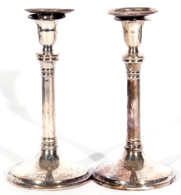 Lot 66 - Pair of George V silver candlesticks of plain...