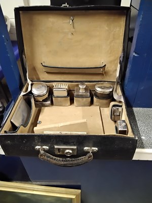 Lot 2 - A cased travelling vanity set with silver...