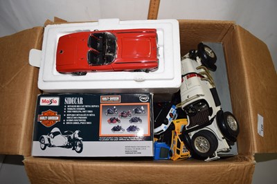 Lot 120 - A box of various toy vehicles, a model Harley...