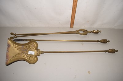 Lot 144 - A brass three piece fire tool set