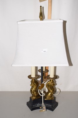 Lot 163 - A table lamp, the base formed as three...