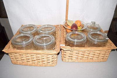 Lot 180 - Two wicker baskets containing glass storage jars