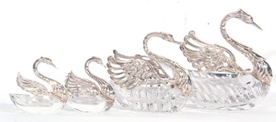 Lot 97 - Group of four cut glass and white metal swan...
