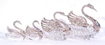 Lot 97 - Group of four cut glass and white metal swan...