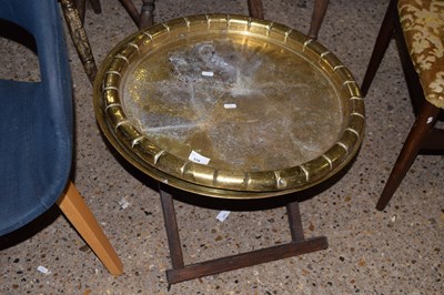 Lot 318 - Two brass trays and one folding stand (3)