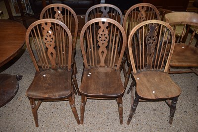 Lot 327 - A set of six wheel and stick back elm seated...