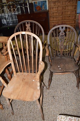 Lot 329 - Two stick and wheel back carver chairs...