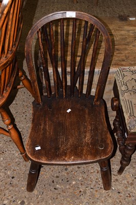 Lot 352 - An elm seated stick back kitchen chair
