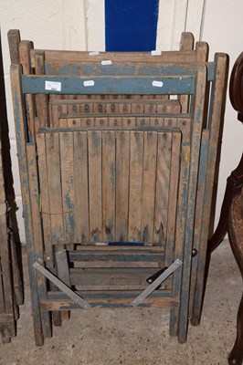 Lot 391 - A set of four folding slatted wooden chairs