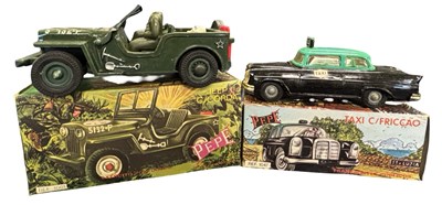 Lot 262 - A pair of boxed Portuguese plastic friction...