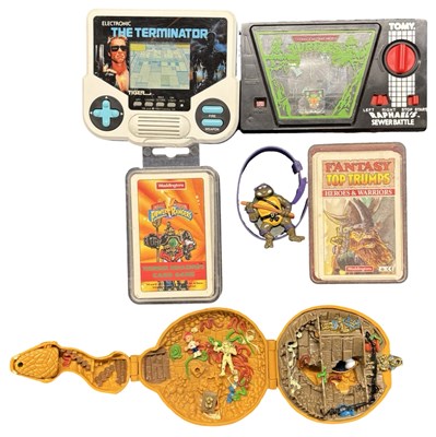 Lot 243 - A collection of retro toys and accessories, to...
