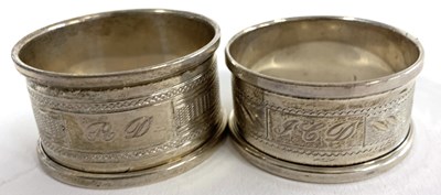Lot 119 - Two Elizabeth II silver napkin rings of...