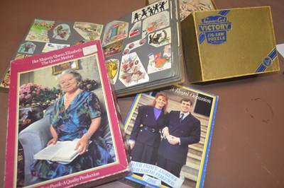 Lot 317 - Postcard album an a number of jigsaws...