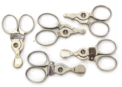 Lot 110 - A group of five vintage cigar cutters/piercers...