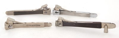 Lot 119 - A group of four long handled cigar cutters...
