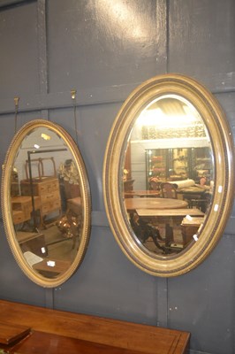 Lot 371 - Two 20th Century wall mirrors of slightly...