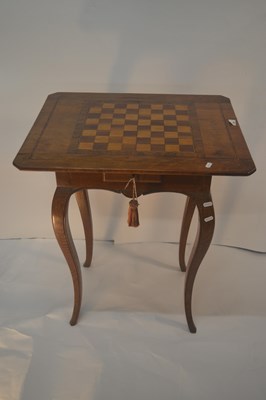 Lot 399 - A continental walnut and inlaid games table,...