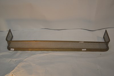 Lot 437 - A Victorian pierced brass fire fender, 115cm wide