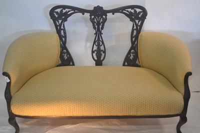Lot 441 - An Edwardian sofa with carved and fretwork...