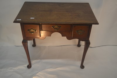 Lot 446 - A George III oak low boy of typical form with...