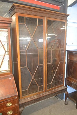 Lot 463 - An Edwardian bookcase cabinet in the Georgian...