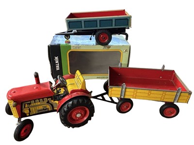 Lot 251 - A tinplate Zetor tractor and trailer model,...