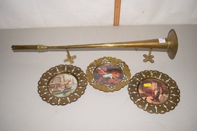 Lot 163 - Set of three brass wall plaques and a brass horn