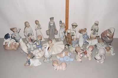 Lot 201 - A collection of various Nao and Lladro figures,...